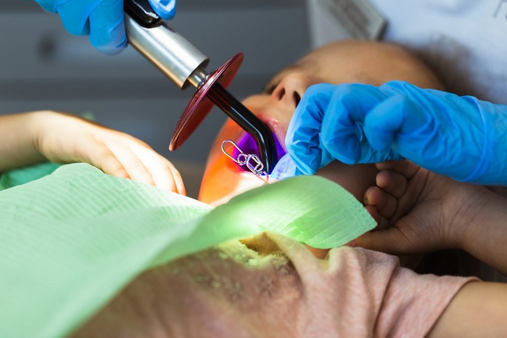 Child to the dentist. Child in the dental chair dental treatment